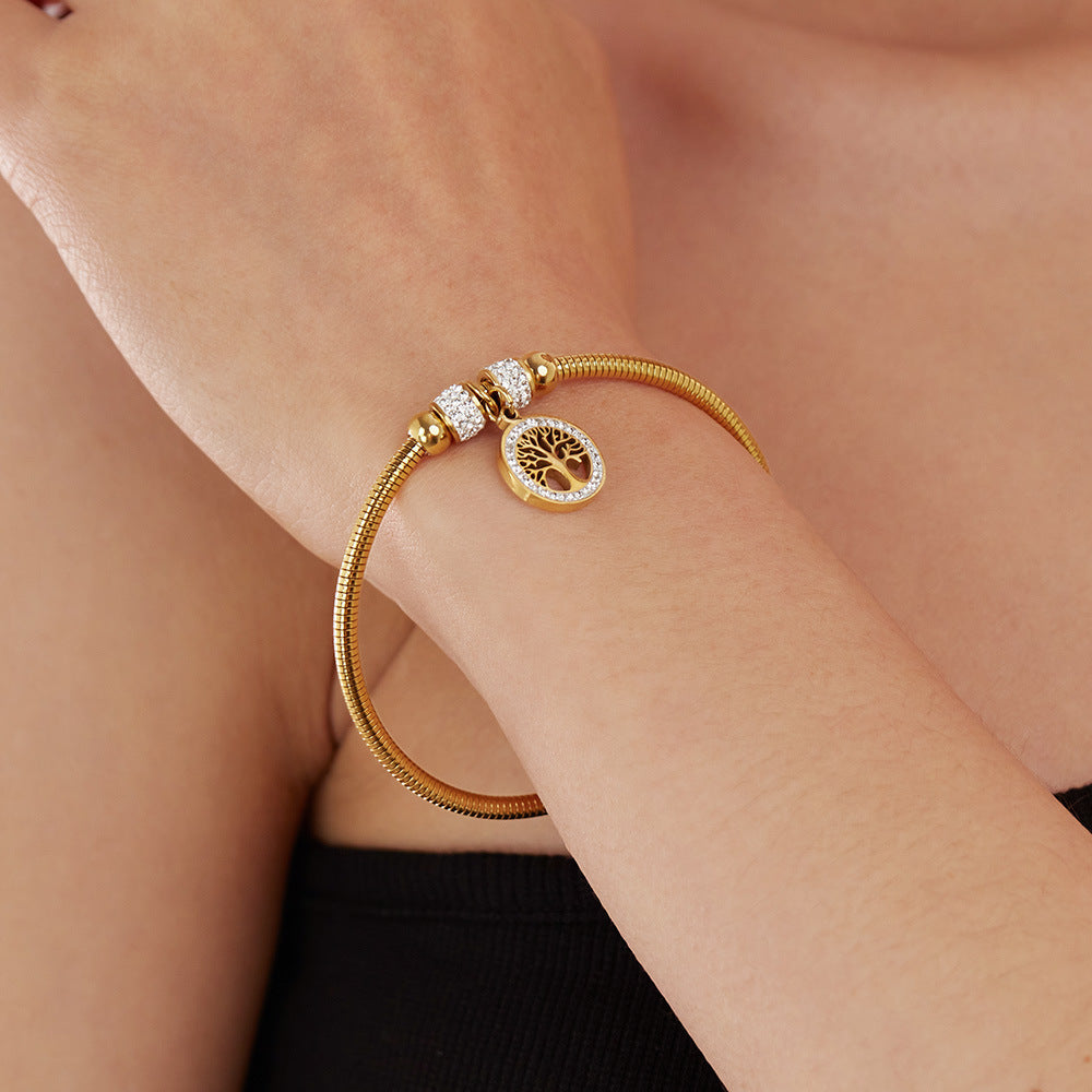Armband mit Lebensbaum-Anhänger und Kristallakzent aus Edelstahl – elegantes Design