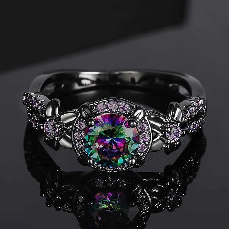 Schwarzer Ring mit schillerndem Zirkon und Schleifendetail